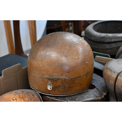 529 - A good collection of antique milliner's wooden hat blocks and brims, all unnamed, two numbered examp... 