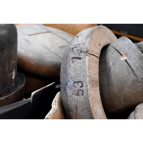 529 - A good collection of antique milliner's wooden hat blocks and brims, all unnamed, two numbered examp... 