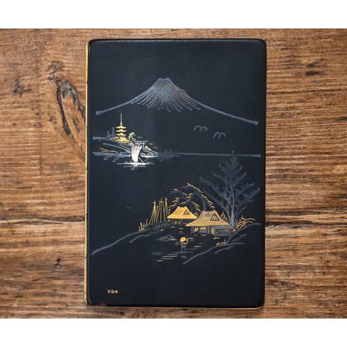 535 - A Japanese boxed lacquered metal cigarette case with sliding hinge, decorated with Mount Fuji landsc... 