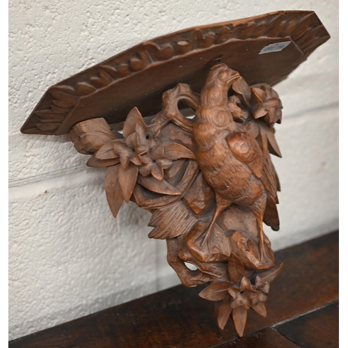 536 - A Black Forest wall bracket carved with a bird, 18.5 cm, to/w a pair of oak twist candlesticks and a... 