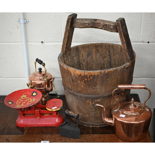 550 - An Asian wood bucket, to/w a Victorian brass and copper kettle on stand, a copper kettle, a box iron... 