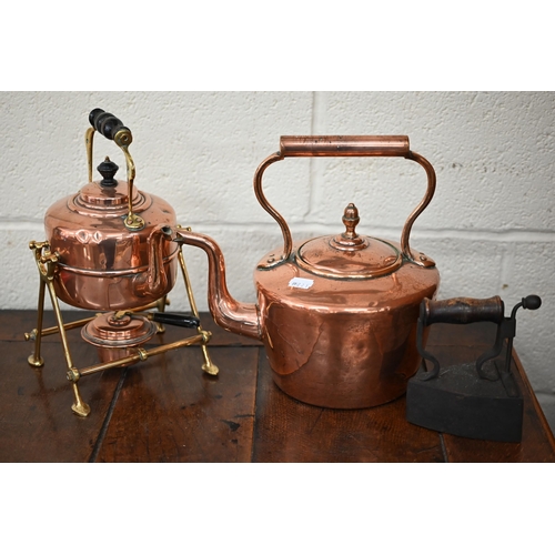 550 - An Asian wood bucket, to/w a Victorian brass and copper kettle on stand, a copper kettle, a box iron... 