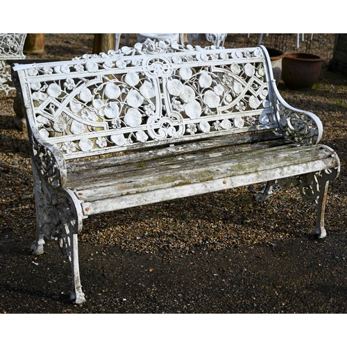 A weathered and white painted Coalbrookdale style cast alloy garden bench