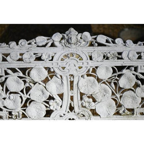 61 - A weathered and white painted Coalbrookdale style cast alloy garden bench