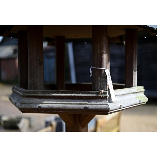 63B - A traditional bird house/feeder on stand, with slate roof