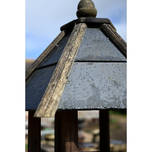 63B - A traditional bird house/feeder on stand, with slate roof