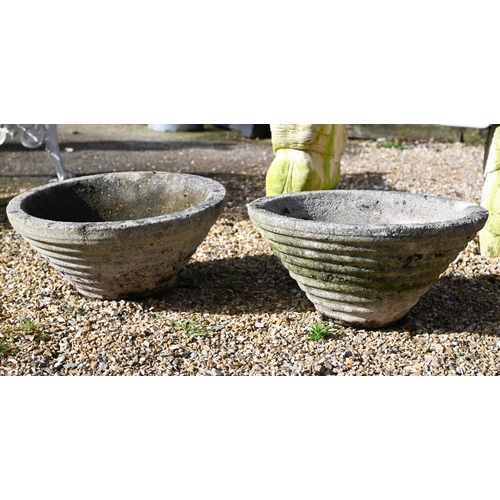 64 - A weathered cast stone column birdbath to/with a pair of conical form planters (3)