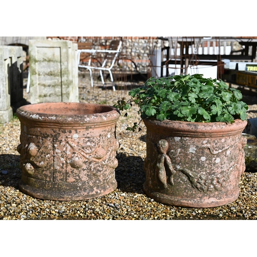 66 - Two weathered cast terracotta tub planters, one fruit design, one cherubs (2)