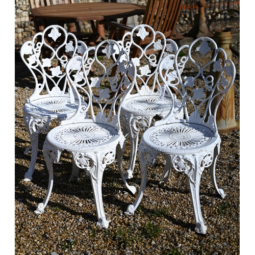 70 - A set of four weathered Victorian style cast alloy white painted terrace chairs (4)