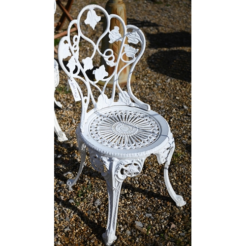 70 - A set of four weathered Victorian style cast alloy white painted terrace chairs (4)