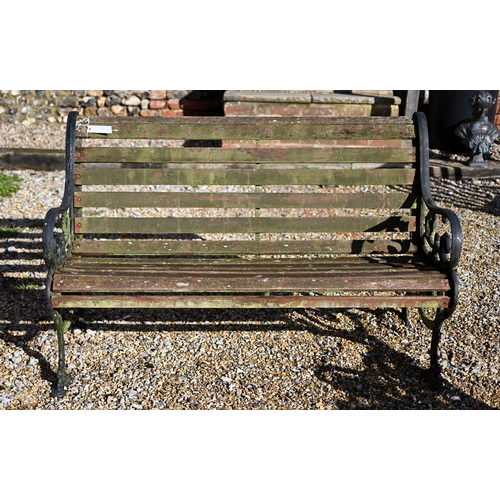 78 - A teak slat garden bench with cast alloy ends