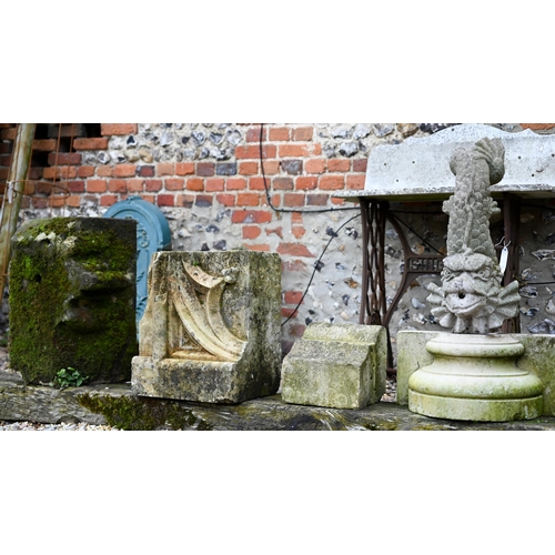 83 - Assorted antique and later carved stone architectural fragments to/with a cast sea monster garden sc... 