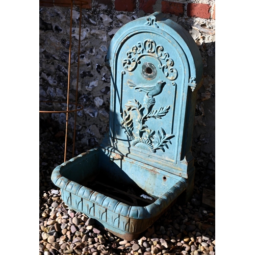 85 - A weathered old cast iron two piece garden wall mount fountain, with basin - no fittings and as remo... 