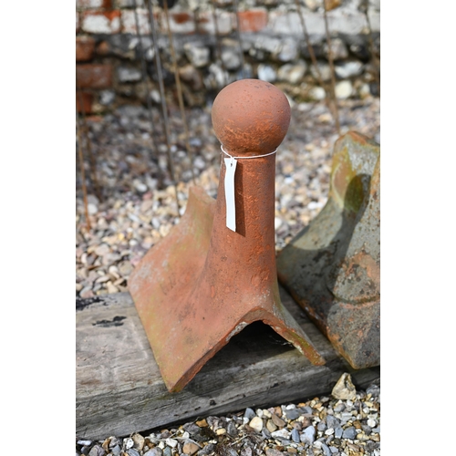 86 - A trio of differing old weathered Bridgwater terracotta ball finial ridge tiles, a/f (3)