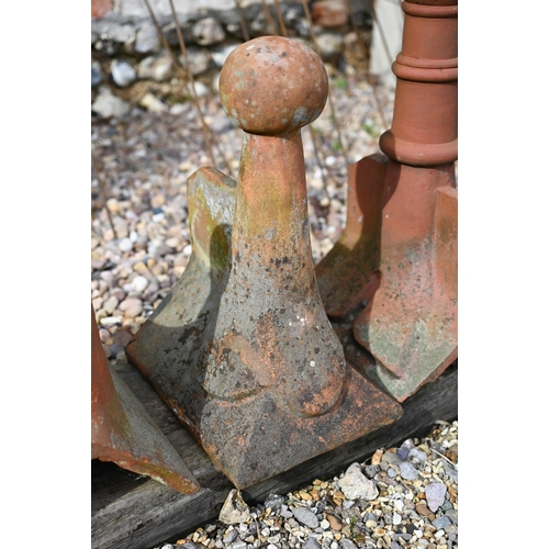 86 - A trio of differing old weathered Bridgwater terracotta ball finial ridge tiles, a/f (3)