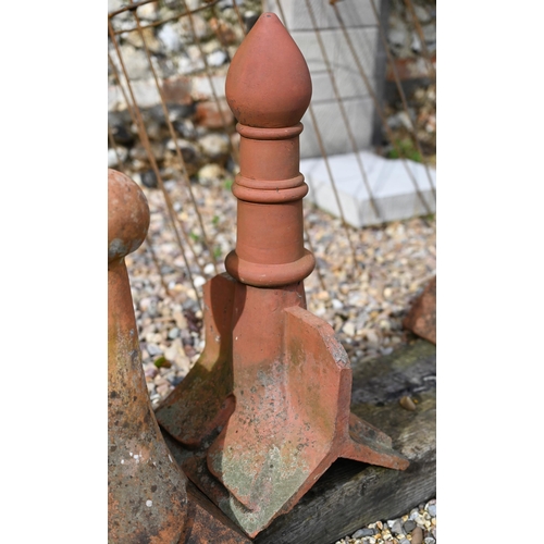 86 - A trio of differing old weathered Bridgwater terracotta ball finial ridge tiles, a/f (3)