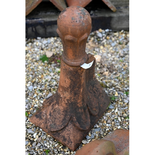 88 - A weathered terracotta ball head finial ridge tile to/with a scroll finial ridge tile, a/f (2)