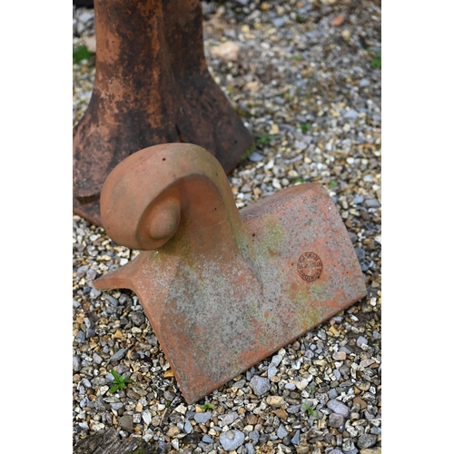 88 - A weathered terracotta ball head finial ridge tile to/with a scroll finial ridge tile, a/f (2)