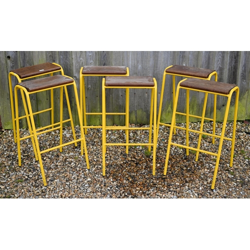 93 - A set of six yellow framed mid-height stacking lab stools, with hardwood seats (6)