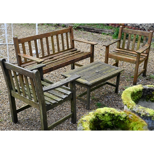 99 - A weathered teak garden bench to/with a pair of arm chairs and a coffee table (5)