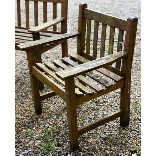 99 - A weathered teak garden bench to/with a pair of arm chairs and a coffee table (5)