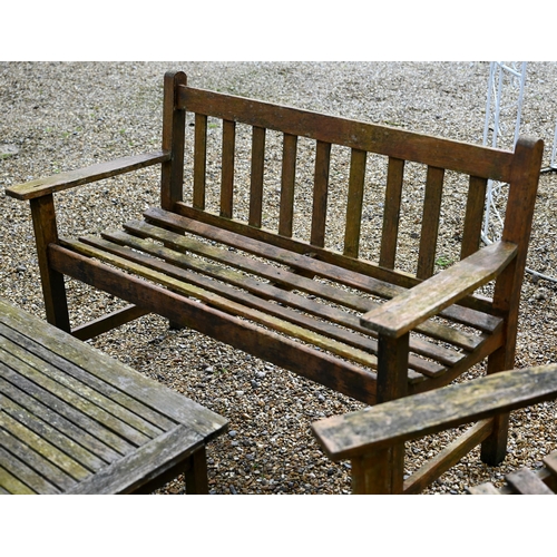 99 - A weathered teak garden bench to/with a pair of arm chairs and a coffee table (5)