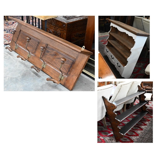 197 - A panelled oak hall shelf with four wrought iron hat/coat hooks, 100 cm wide x 40 cm high to/w a par... 