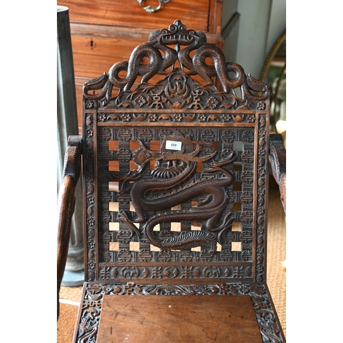 269 - An antique Chinese carved and moulded dragon back chair with hinged seat, a/f