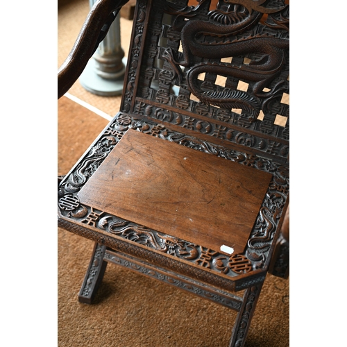 269 - An antique Chinese carved and moulded dragon back chair with hinged seat, a/f