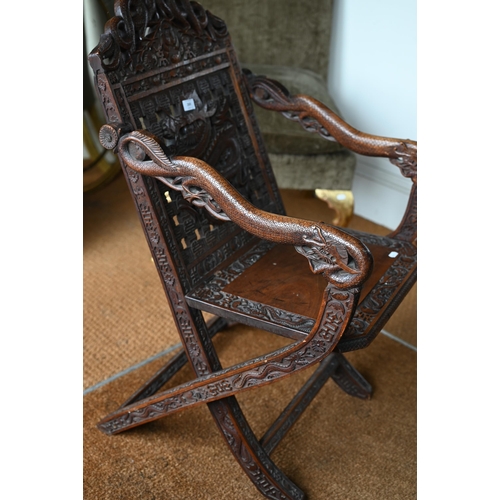 269 - An antique Chinese carved and moulded dragon back chair with hinged seat, a/f