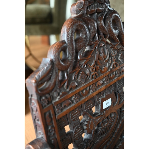 269 - An antique Chinese carved and moulded dragon back chair with hinged seat, a/f