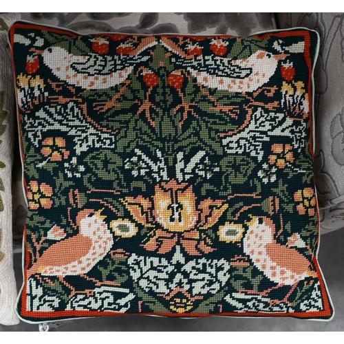 387 - # A floral crewel work cushion and pictorial tapestry cushion, both 40 cm square (2)