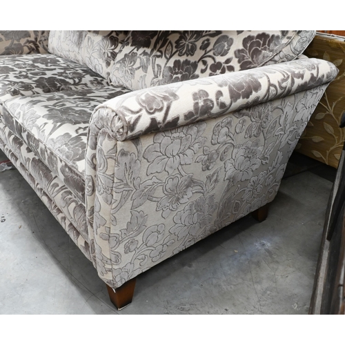 388 - A modern three-seated sofa, the two tone silvered damask style upholstery on square stained hardwood... 