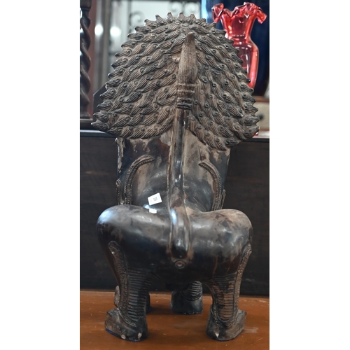 559 - An Asian bronzed ceramic temple lion, 53cm high