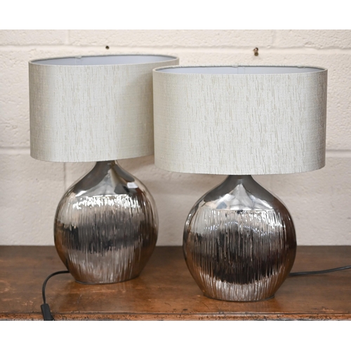 580 - # Two classical column metal table lamps to/w a pair of silvered table lamps and a set of three glas... 