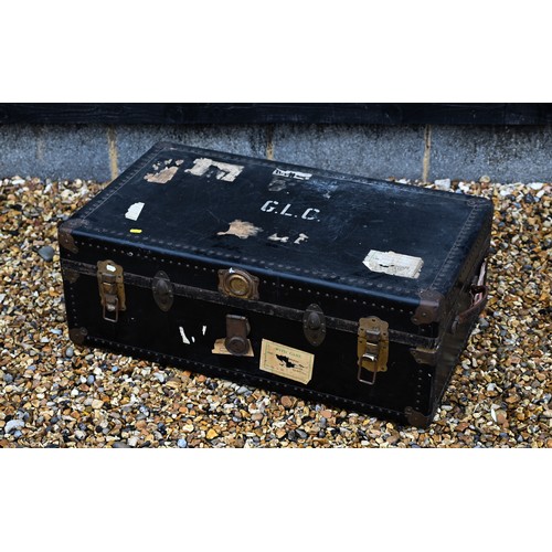 210 - A vintage navy blue steamer/school trunk stenciled ownership, initials 'G.L.C' and remnants of paper... 