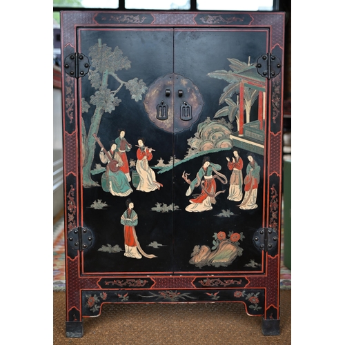 119 - A Japanese black lacquered and polychrome pictorial decorated cabinet, 62 cm x 31 cm x 92 cm h, lock... 