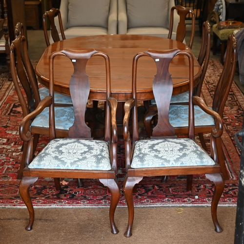 338 - A set of eight Queen Anne style walnut dining chairs, with blue damask pad seats, comprising six sta... 