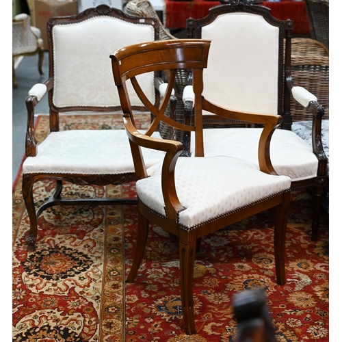 629 - #Three differing continental carved walnut framed and fabric panelled salon open armchairs (3)