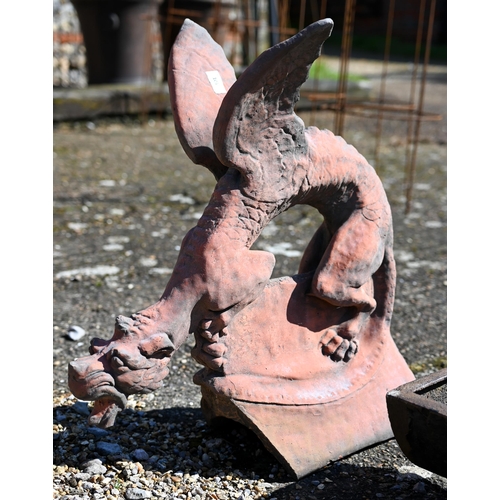 101 - A reconstituted aged terracotta large 'dragon' ridge tile, 65 cm high