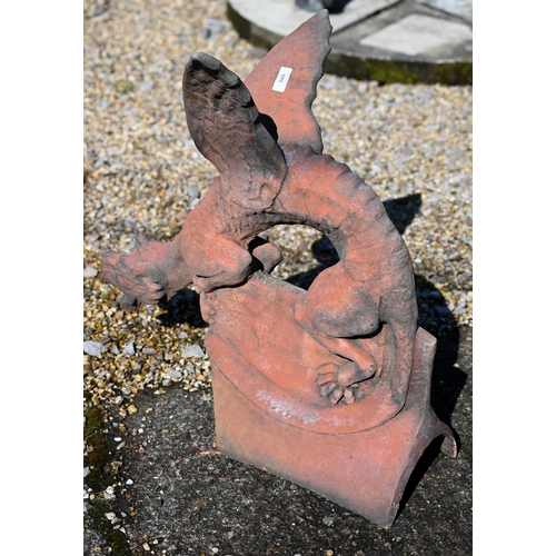 101 - A reconstituted aged terracotta large 'dragon' ridge tile, 65 cm high