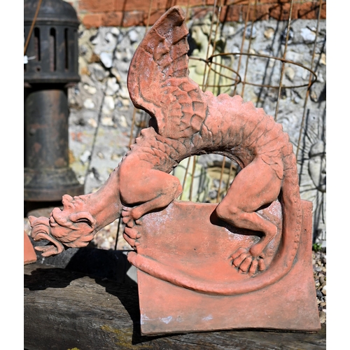 102 - A large cast terracotta dragon ridge tile, 63 cm h