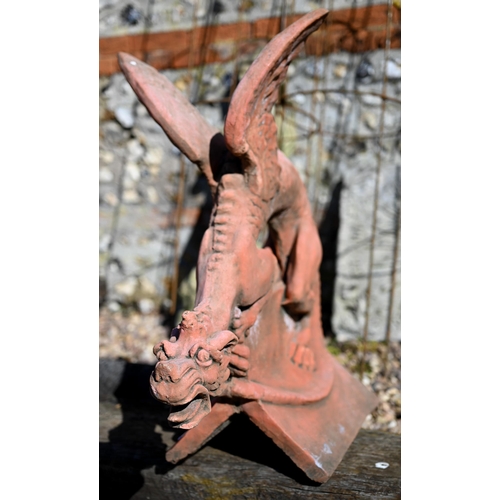 102 - A large cast terracotta dragon ridge tile, 63 cm h