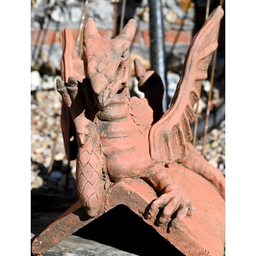 109 - A small cast terracotta recumbent dragon ridge tile, 35 cm h