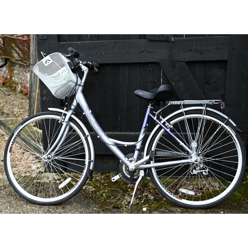A ladies Raleigh Airline bicycle with manual and tools in the fitted shopper basket to/w a Pioneer Metro bike rack (20