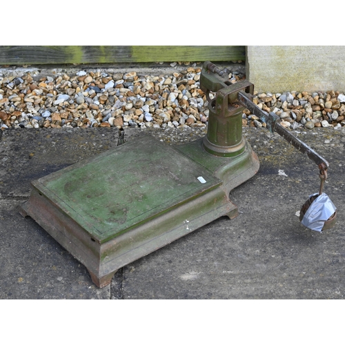 124 - A vintage cast iron platform scale to/with a counter top platform scale, a Shell Aviation Spirit pet... 