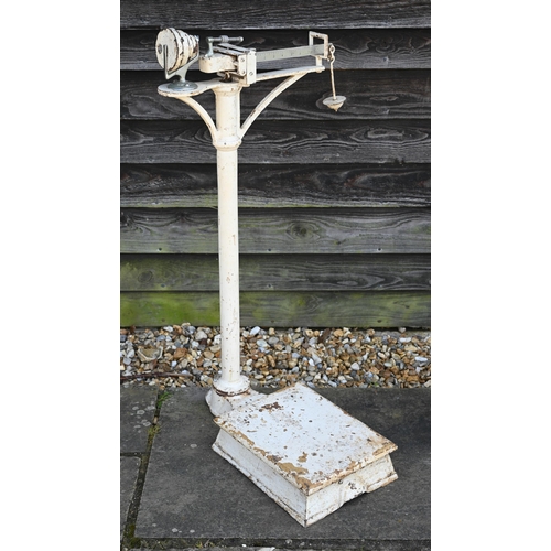 124 - A vintage cast iron platform scale to/with a counter top platform scale, a Shell Aviation Spirit pet... 