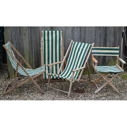 129 - Three vintage green-striped deckchairs to/with a conforming folding table (4)