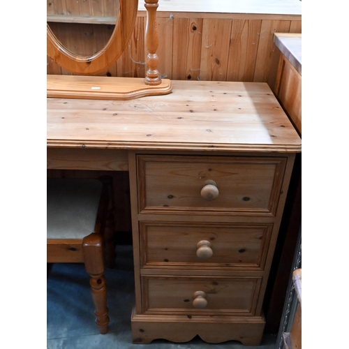 132 - A modern pine dressing table with three drawers c/w oval mirror and stool, 108 x 45 x 75 cm high