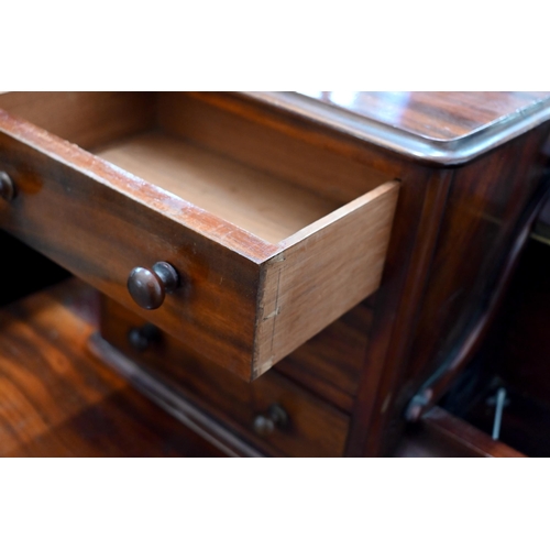 136 - #A Victorian mahogany dressing table on spiral fluted supports joined by concaved platform base, 120... 